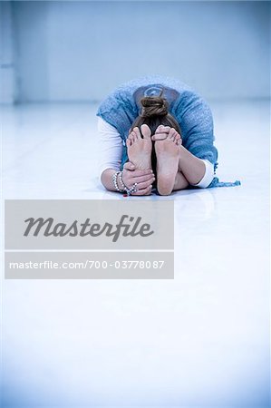 Woman in Sitting Forward Bend Position