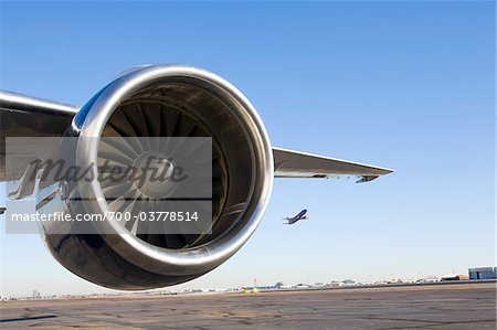 Close-Up of Airplane Engine on Runway