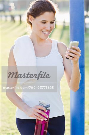 Woman Wearing Exercise Clothing with Cell Phone