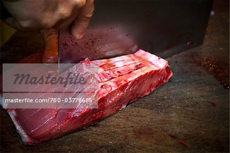 Fishmonger Cutting Salmon, Vucciria Market, Vucciria District, Palermo, Sicily, Italy