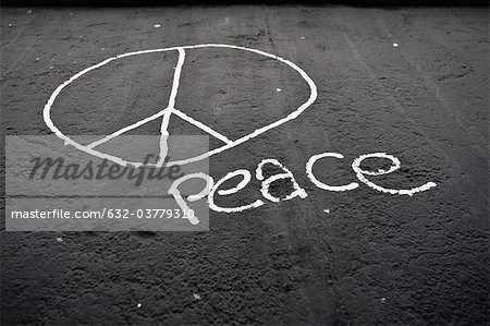Peace sign and the word "peace" painted on the Berlin Wall, Berlin, Germany