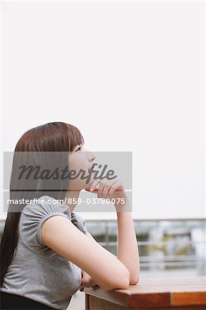 Teenage Girl Sitting And Thinking