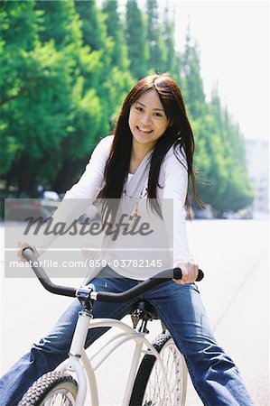 Japanese Young Woman Riding Bicycle