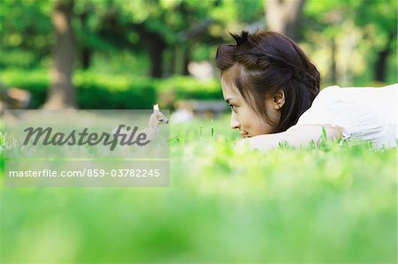 Japanese Young Woman Lying on Grass