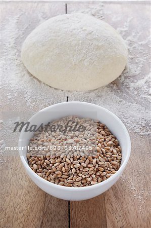 Bowl of Cereal Grain and Mound of Dough