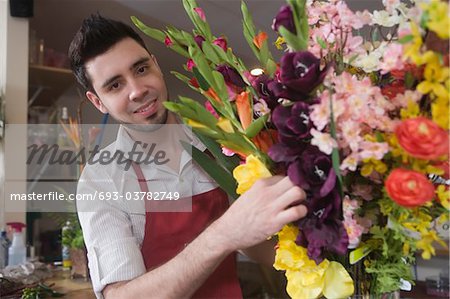 Florist works on flower arrangement