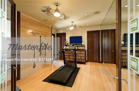 Interior with gym equipment and wooden floor