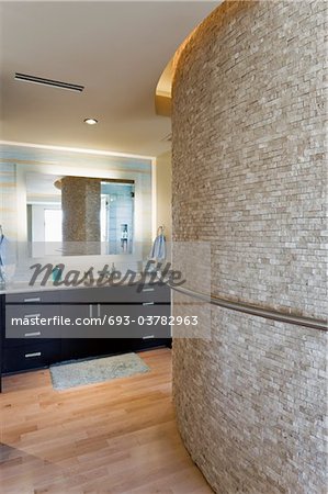 Bathroom interior with large curved wall