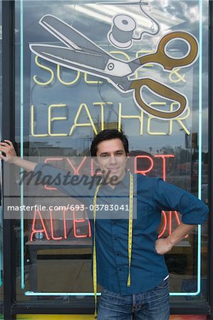 Man standing infront of laundrette shop window