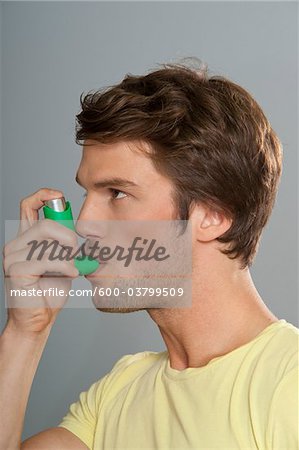 Man Using Inhaler