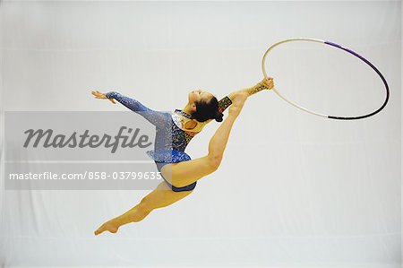 Japanese woman performing gymnastics with hoop