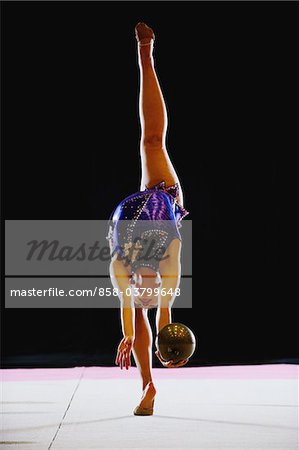 Acrobat performing with ball