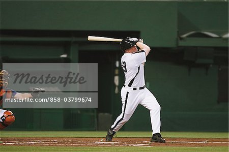 Players playing baseball game