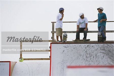Skateboarders talking to each other