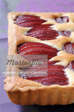 Pears poached in red wine tart