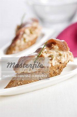 Tuna,anchovy and capers on a bite-size slice of bread