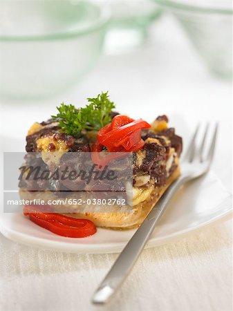 Blood sausage,onion,egg and red pepper canapé