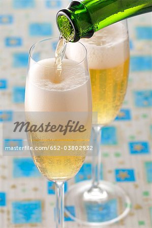 Pouring glasses of Champagne Pouring glasses of Champagne