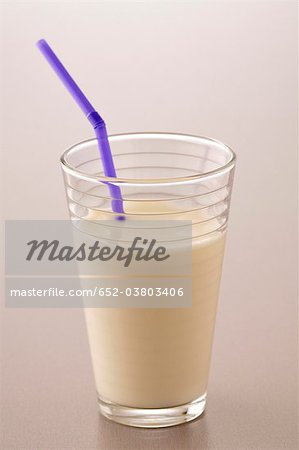 Glass of milk with straw