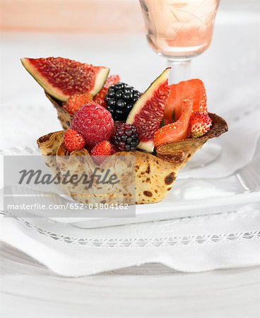Small pastry basket full of summer fruit Small pastry basket full of summer fruit