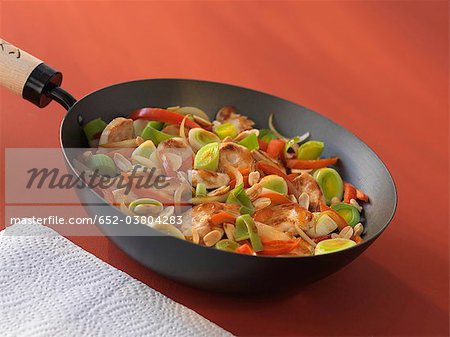 Chicken,vegetables and peanuts cooked in a wok