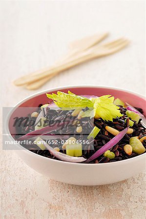 Brown and wild rice with chopped celery stalks