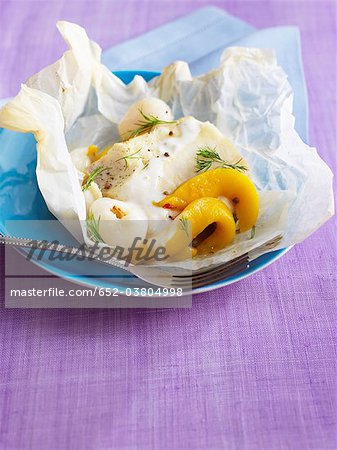 Cod with exotic fruit cooked in wax paper Cod with exotic fruit cooked in wax paper