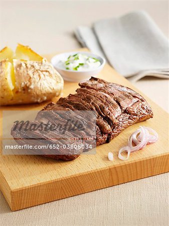 Grilled sirloin steak with a baked potato