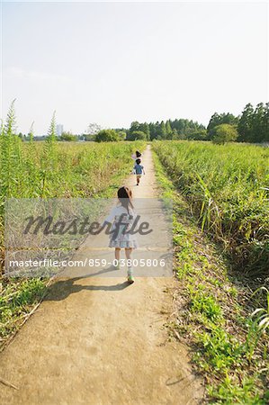 Children Walking on Rural Walkway