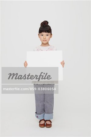 Smiling Girl Holding Whiteboard