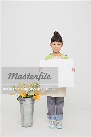 Girl Holding Placard with Bucket of Flowers