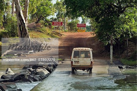 Australia, Northern Territory, Kakadu National Park.  Traversing the East Alligator River at Cahill's Crossing.  The river is the boundary between Kakadu and Arnhem Land.