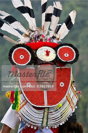 Myanmar, Burma, Naga Hills.  A Tangkhul Naga in his ceremonial finery celebrating the Naga New Year Festival (Kaing Bi) in Leshi village.