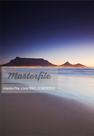 View of Table Mountain at sunset from Milnerton beach, Cape Town, Western Cape, South Africa