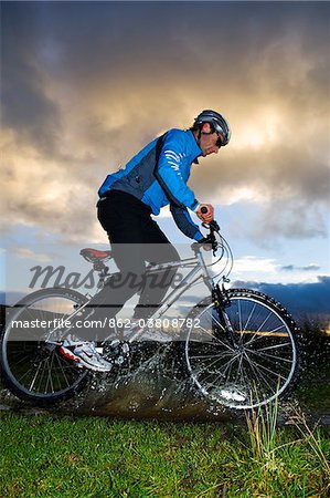 UK; North Wales, Snowdonia.  Man mountain biking.