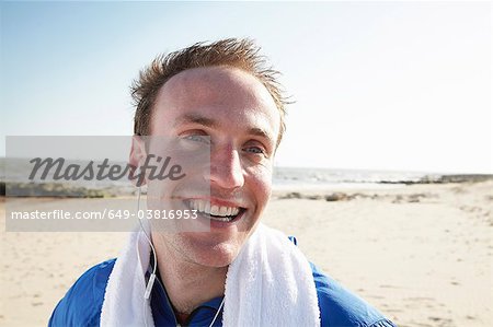Happy man on beach after exercise