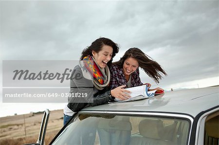 Friends looking in map