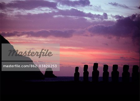 Seven of the fifteen colossal stone statues or moais of Tongariki at sunrise. The moais stand on their platform or ahu on the eastern coast of the island at the foot of the Poike Peninsula. Ahu Tongariki is the largest platform on the island at over 200m in length and has the most maois.