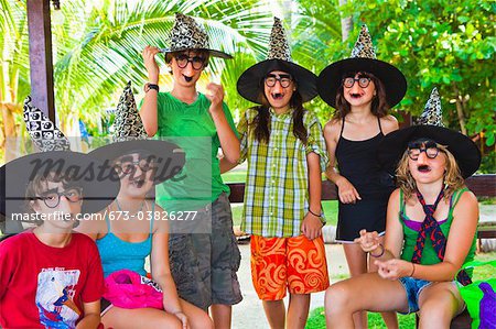 children in witch hats and masks