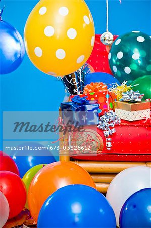 red chair with gifts and balloons