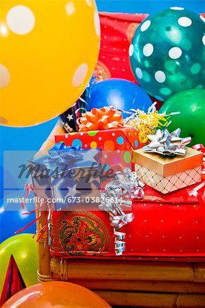 red chair with gifts and balloons