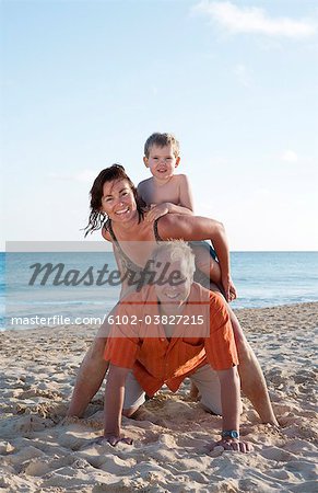 A family on a beach.