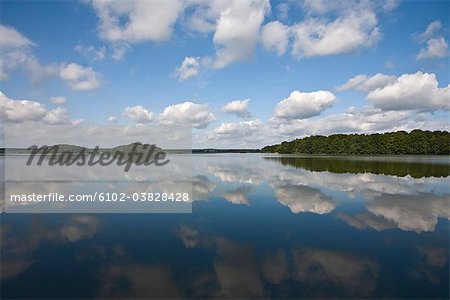 Clouds reflected on the surface of a lake, Sweden.