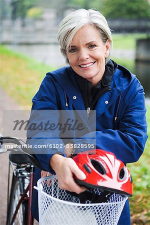 Female cyclist in a park, Stockholm, Sweden.