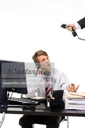 A teenage boy as a businessman at the office.