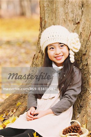 Girl Relaxing Under Tree