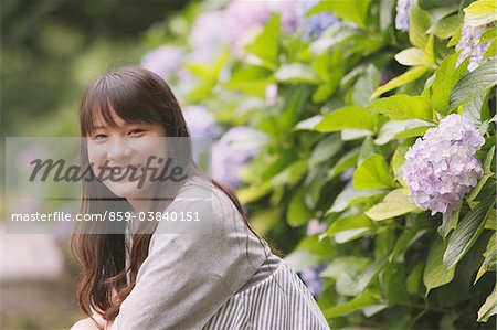 Young adult woman with Hydrangea