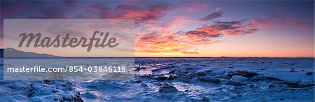 Panoramic scenic at sunset of the Anchorage Coastal Wildlife Refuge with Kenai Mountains in the background, Southcentral Alaska, Winter