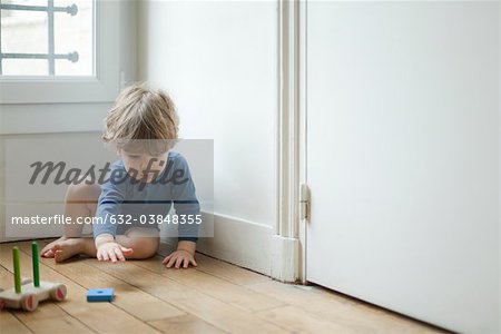 Toddler boy playing with toy
