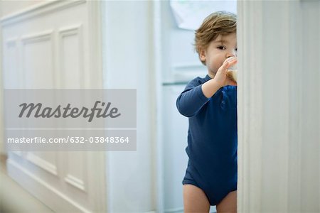 Toddler boy drinking from bottle